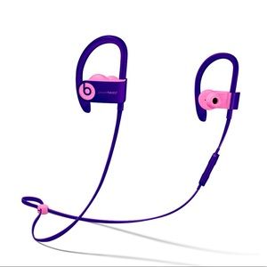 Power beats earphones with charging cord and case.